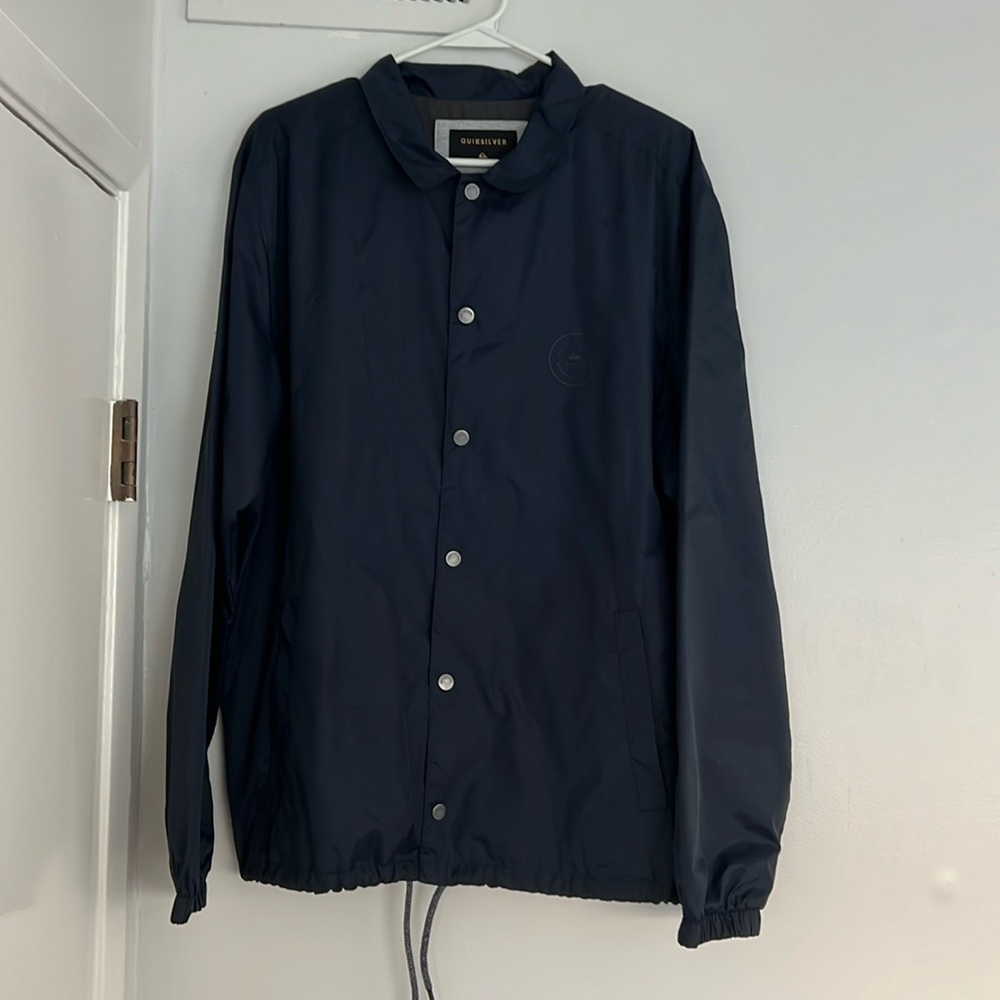 Quicksilver windbreaker jacket. Navy. Barley worn. Size L